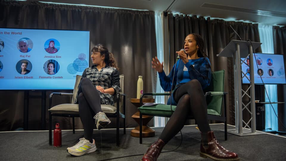 Feimatta Conteh (right) speaking at We Make Tomorrow 2022. Photo by toastandpost